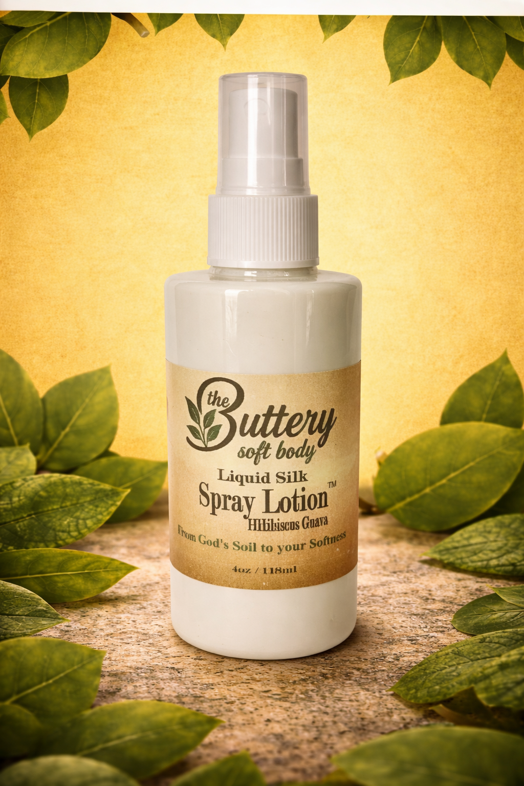 Buttery soft body spray lotion bottle with leaves in the background