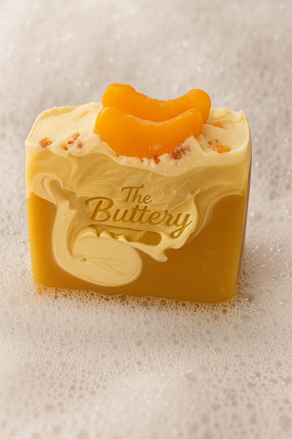 Fresh Squeezed Oranges Bath Bar with creamy texture and orange slices on top amidst bubbles.